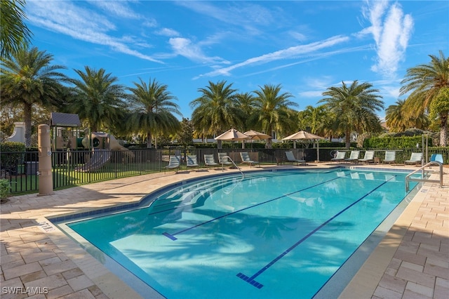 16382 Viansa Way Unit 3-202, Naples, FL 34110 - community pool with a patio