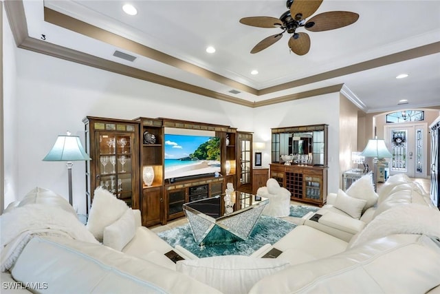 11177 Monte Carlo Blvd, Bonita Springs, FL 34135 - living area with ornamental molding, ceiling fan, a raised ceiling, and recessed lighting