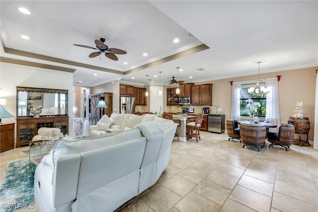 11177 Monte Carlo Blvd, Bonita Springs, FL 34135 - living area featuring a raised ceiling, ceiling fan, crown molding, recessed lighting, and light tile patterned floors
