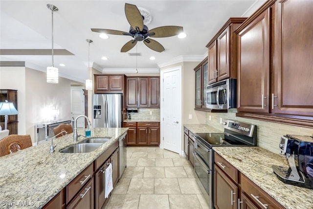 11177 Monte Carlo Blvd, Bonita Springs, FL 34135 - kitchen with stainless steel appliances, a ceiling fan, crown molding, backsplash, and light stone countertops