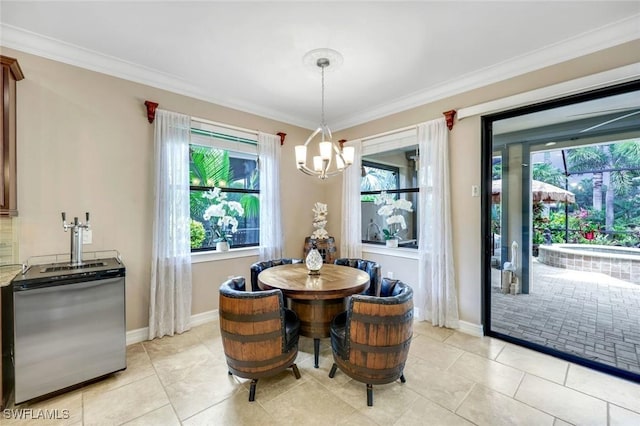 11177 Monte Carlo Blvd, Bonita Springs, FL 34135 - dining room with a chandelier, plenty of natural light, ornamental molding, and light tile patterned floors