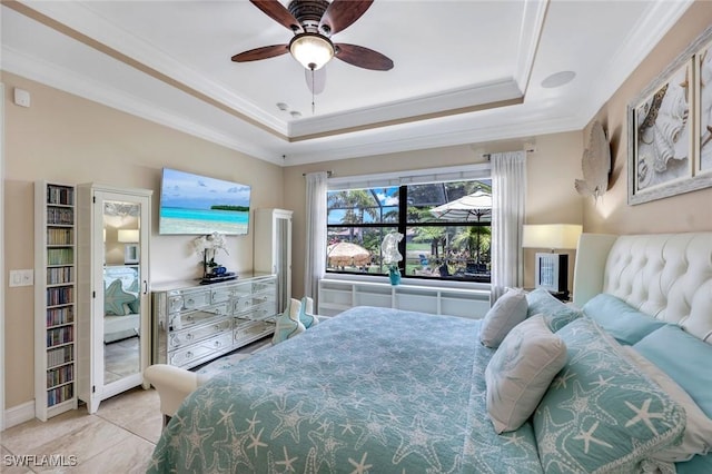 11177 Monte Carlo Blvd, Bonita Springs, FL 34135 - bedroom featuring a tray ceiling, ornamental molding, tile patterned floors, and a ceiling fan