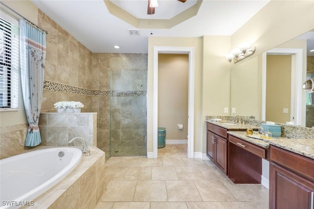 11177 Monte Carlo Blvd, Bonita Springs, FL 34135 - full bathroom featuring a bath, a stall shower, vanity, a ceiling fan, and tile patterned flooring