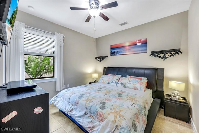 11177 Monte Carlo Blvd, Bonita Springs, FL 34135 - bedroom with tile patterned floors and ceiling fan