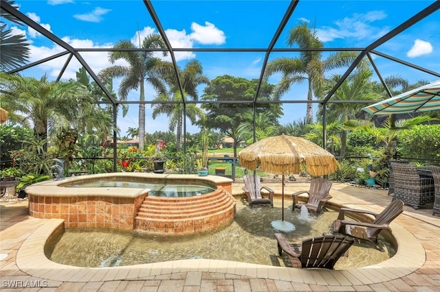 11177 Monte Carlo Blvd, Bonita Springs, FL 34135 - view of patio / terrace with an in-ground hot tub and glass enclosure