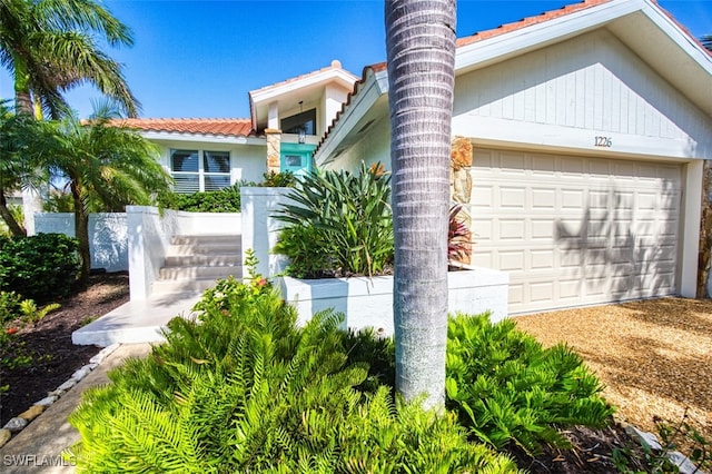 1226 Par View Dr, Sanibel, FL 33957 - view of front facade with a tiled roof and stucco siding