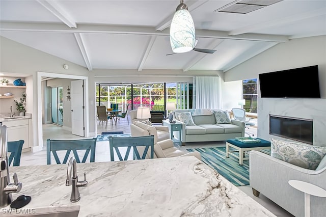 1226 Par View Dr, Sanibel, FL 33957 - living room featuring a ceiling fan, a premium fireplace, and baseboards