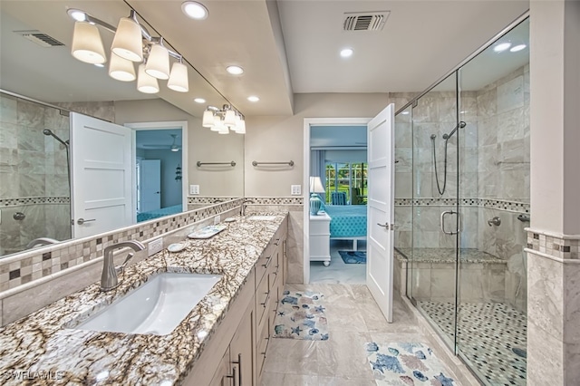 1226 Par View Dr, Sanibel, FL 33957 - full bathroom with recessed lighting, double vanity, a shower stall, tile walls, and marble look tile flooring