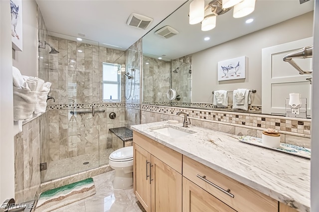 1226 Par View Dr, Sanibel, FL 33957 - bathroom featuring toilet, vanity, a shower stall, marble finish floors, and decorative backsplash
