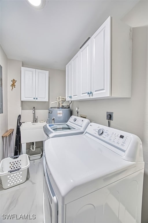1226 Par View Dr, Sanibel, FL 33957 - laundry room featuring cabinet space, washer and dryer, and water heater