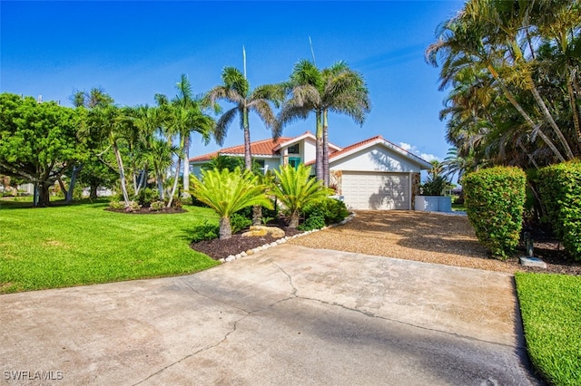 1226 Par View Dr, Sanibel, FL 33957 - view of front of home with driveway, a front lawn, stucco siding, a tile roof, and a garage
