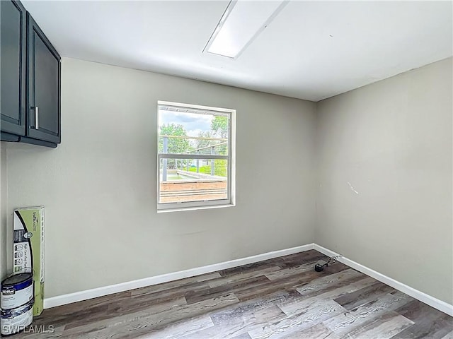 93 E Mariana Ave, North Fort Myers, FL 33917 - laundry room with wood finished floors and cabinet space