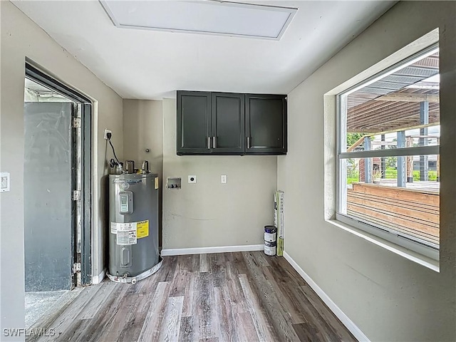 93 E Mariana Ave, North Fort Myers, FL 33917 - washroom with electric dryer hookup, water heater, cabinet space, wood finished floors, and hookup for a washing machine