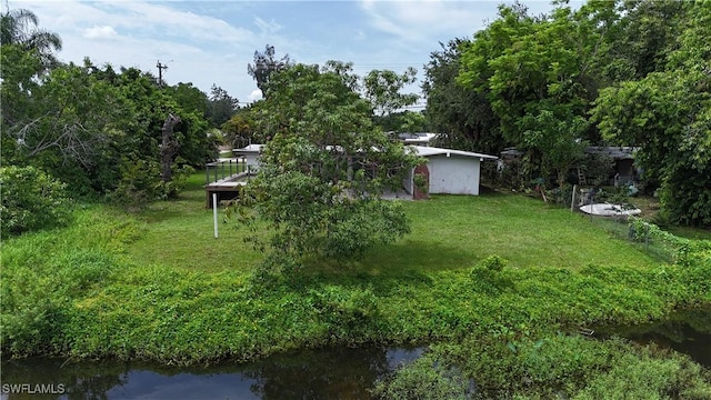 93 E Mariana Ave, North Fort Myers, FL 33917 - view of green lawn with a water view