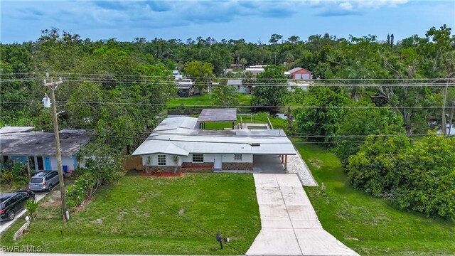 93 E Mariana Ave, North Fort Myers, FL 33917 - aerial view of property and surrounding area with a forest