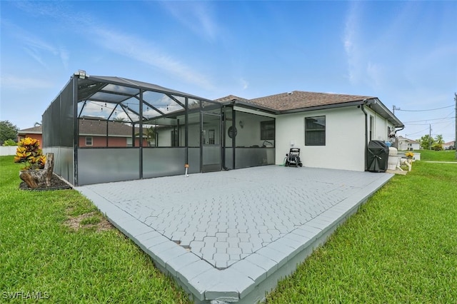 4903 Bygone St, Lehigh Acres, FL 33971 - rear view of house with a yard, a patio, a lanai, and stucco siding