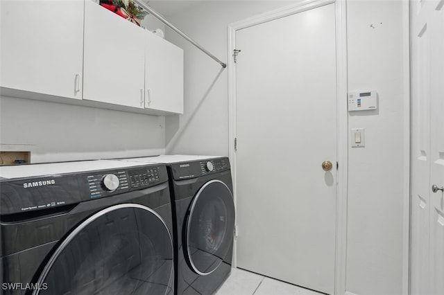 4903 Bygone St, Lehigh Acres, FL 33971 - washroom featuring cabinet space, washer and clothes dryer, and light tile patterned floors