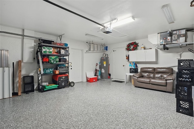 4903 Bygone St, Lehigh Acres, FL 33971 - garage featuring water heater, a garage door opener, and electric panel