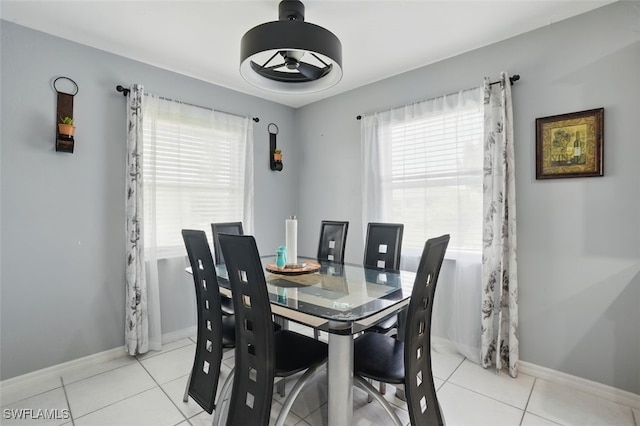4903 Bygone St, Lehigh Acres, FL 33971 - dining area featuring light tile patterned flooring and ceiling fan