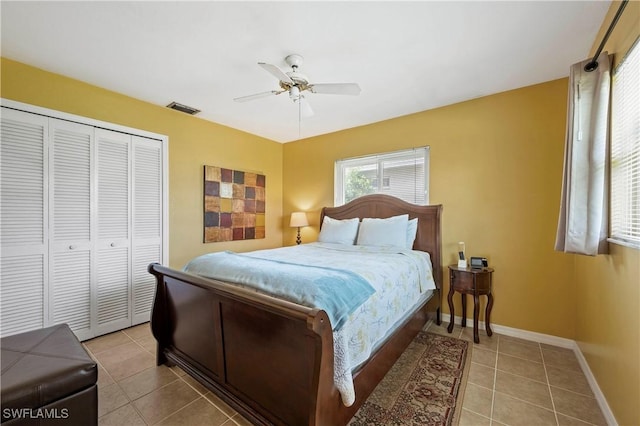 2012 SW 8th Ct, Cape Coral, FL 33991 - tiled bedroom featuring a closet, baseboards, and a ceiling fan