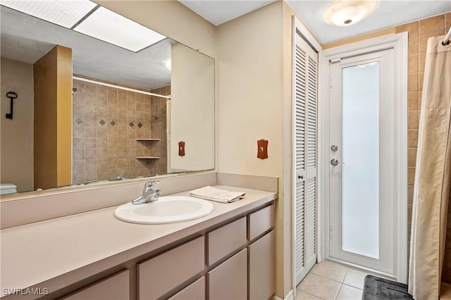 2012 SW 8th Ct, Cape Coral, FL 33991 - full bathroom featuring a closet, vanity, tile patterned floors, a shower with shower curtain, and toilet