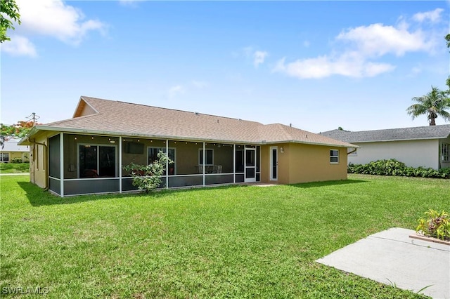 2012 SW 8th Ct, Cape Coral, FL 33991 - back of property featuring a sunroom, a yard, and a shingled roof