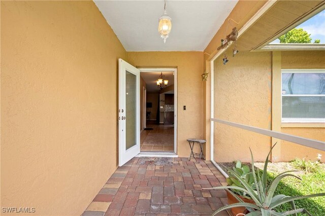 2012 SW 8th Ct, Cape Coral, FL 33991 - doorway to property featuring stucco siding