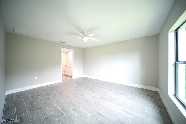 374 Pennfield St, Lehigh Acres, FL 33974 - spare room featuring ceiling fan and baseboards