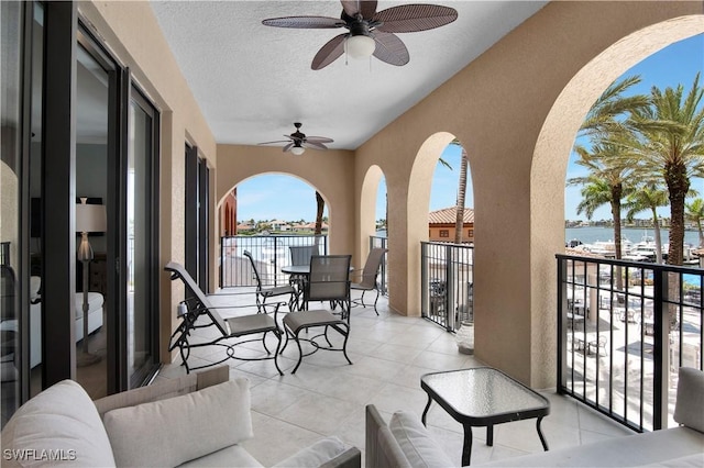 740 N Collier Blvd Unit 206, Marco Island, FL 34145 - balcony with a water view and a ceiling fan