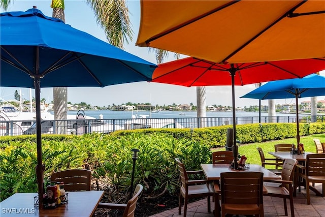 740 N Collier Blvd Unit 206, Marco Island, FL 34145 - view of patio with outdoor dining space and a water view
