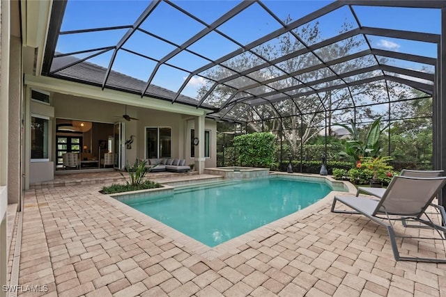 12147 Colliers Reserve Dr, Naples, FL 34110 - view of pool with a patio, ceiling fan, outdoor lounge area, a pool with connected hot tub, and glass enclosure