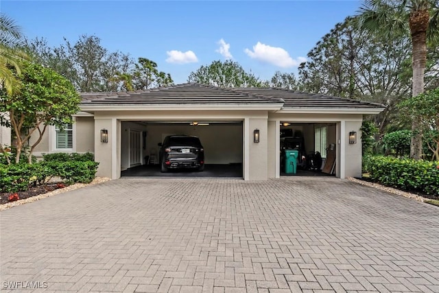 12147 Colliers Reserve Dr, Naples, FL 34110 - garage featuring decorative driveway