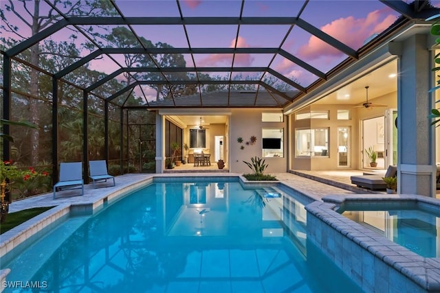 12147 Colliers Reserve Dr, Naples, FL 34110 - view of pool featuring ceiling fan, a patio, a pool with connected hot tub, and glass enclosure