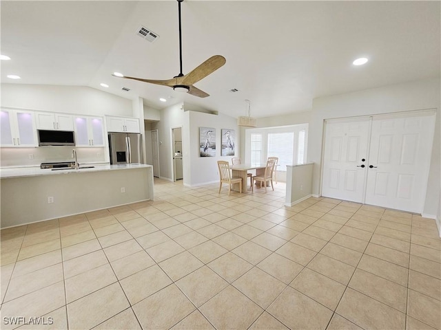1221 SW 10th Ter, Cape Coral, FL 33991 - kitchen featuring appliances with stainless steel finishes, recessed lighting, light countertops, vaulted ceiling, and white cabinetry