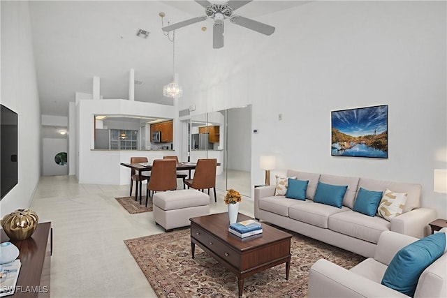 28060 Cavendish Ct Unit 2509, Bonita Springs, FL 34135 - living room with high vaulted ceiling, ceiling fan, and a chandelier