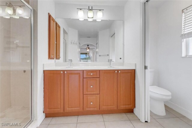 1622 SE 20th St, Cape Coral, FL 33990 - full bathroom with a stall shower, double vanity, toilet, and tile patterned floors