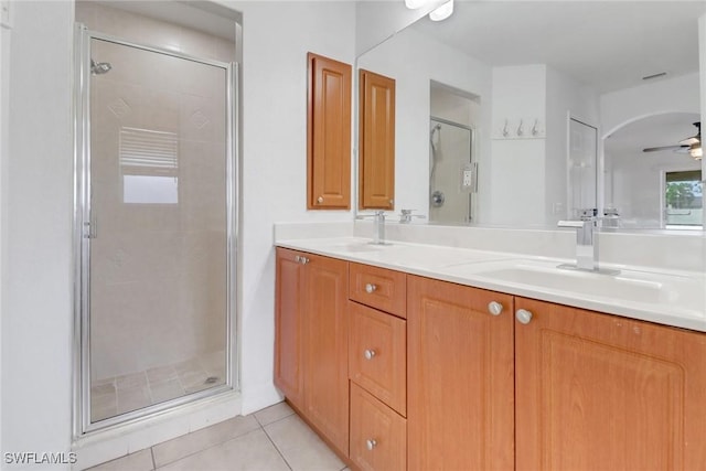 1622 SE 20th St, Cape Coral, FL 33990 - full bathroom featuring a stall shower, tile patterned flooring, double vanity, and ceiling fan