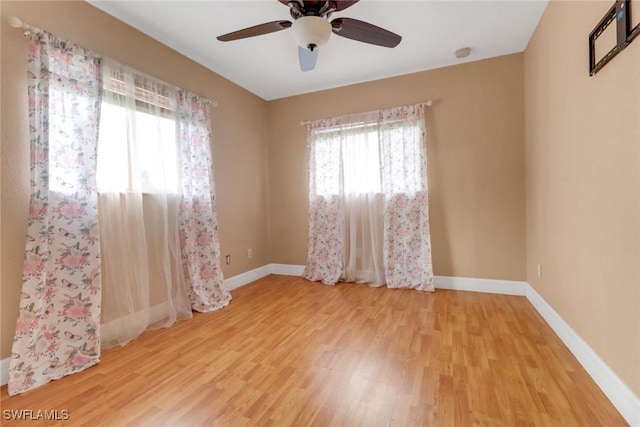 1622 SE 20th St, Cape Coral, FL 33990 - spare room featuring wood finished floors, a ceiling fan, baseboards, and a smoke detector