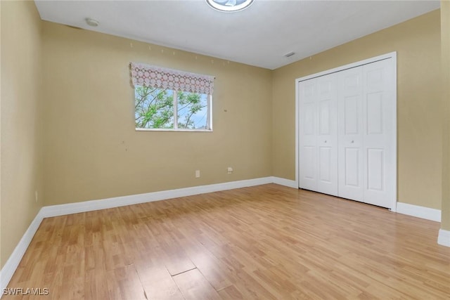 1622 SE 20th St, Cape Coral, FL 33990 - unfurnished bedroom with light wood-style flooring, baseboards, and a closet
