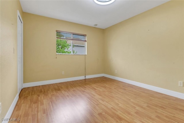 1622 SE 20th St, Cape Coral, FL 33990 - spare room with light wood-style floors and baseboards