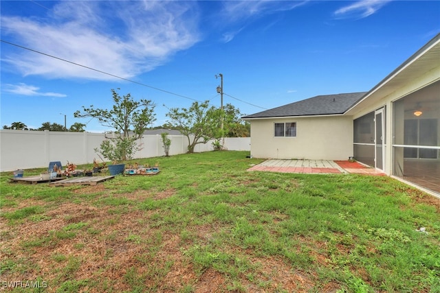 1622 SE 20th St, Cape Coral, FL 33990 - view of yard with a sunroom and a patio