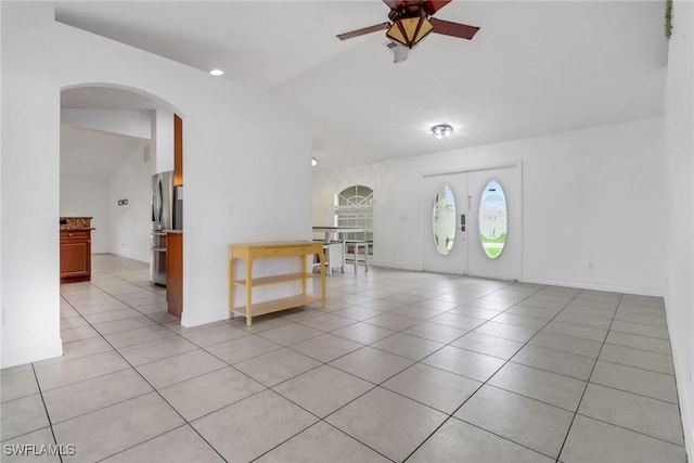 1622 SE 20th St, Cape Coral, FL 33990 - foyer entrance featuring arched walkways, a ceiling fan, light tile patterned flooring, and vaulted ceiling
