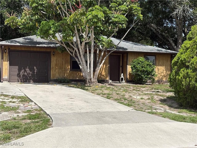 2325 55th Ter SW, Naples, FL 34116 - view of front of property with an attached garage and driveway
