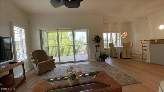 10041 Lake Cove Dr Unit 202, Fort Myers, FL 33908 - living room featuring plenty of natural light and wood finished floors