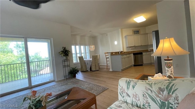 10041 Lake Cove Dr Unit 202, Fort Myers, FL 33908 - living area with light wood-style floors