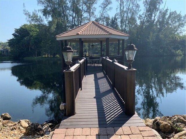10041 Lake Cove Dr Unit 202, Fort Myers, FL 33908 - dock featuring a gazebo and a water view