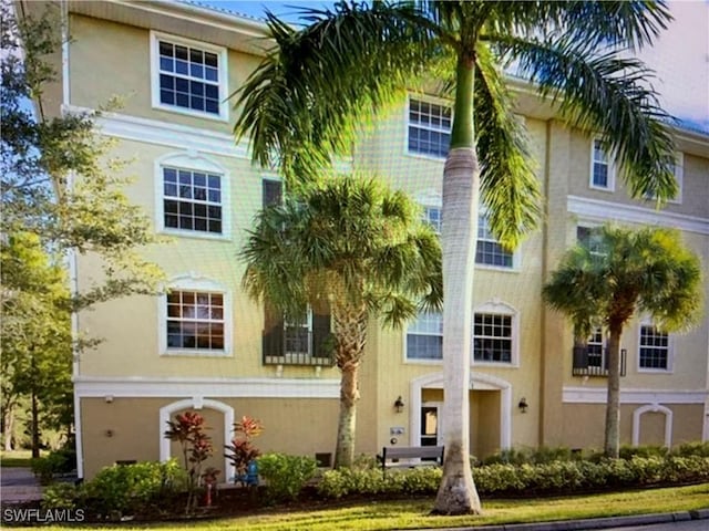 10041 Lake Cove Dr Unit 202, Fort Myers, FL 33908 - view of front of house featuring stucco siding
