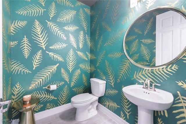 19477 The Place Blvd, Estero, FL 33928 - bathroom featuring toilet, wallpapered walls, tile patterned flooring, and baseboards