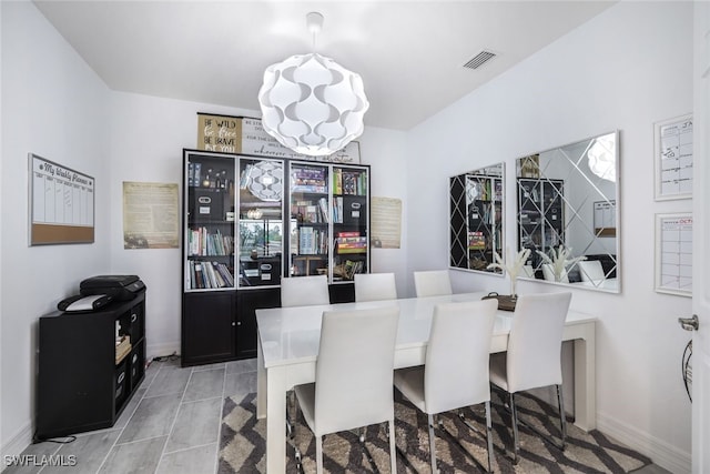 19477 The Place Blvd, Estero, FL 33928 - dining room with a chandelier and baseboards