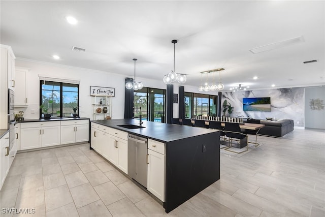 19477 The Place Blvd, Estero, FL 33928 - kitchen with dark countertops, stainless steel appliances, open floor plan, white cabinets, and a sink